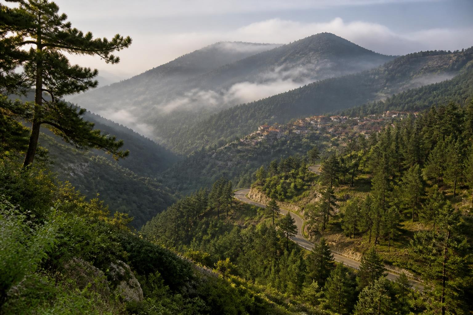 Troodos mountains with pine forests and a traditional mountain village
